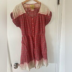 Patterned knee length dress.